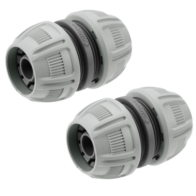 Set of two grey GARDENA 13 mm hose repairers on white background