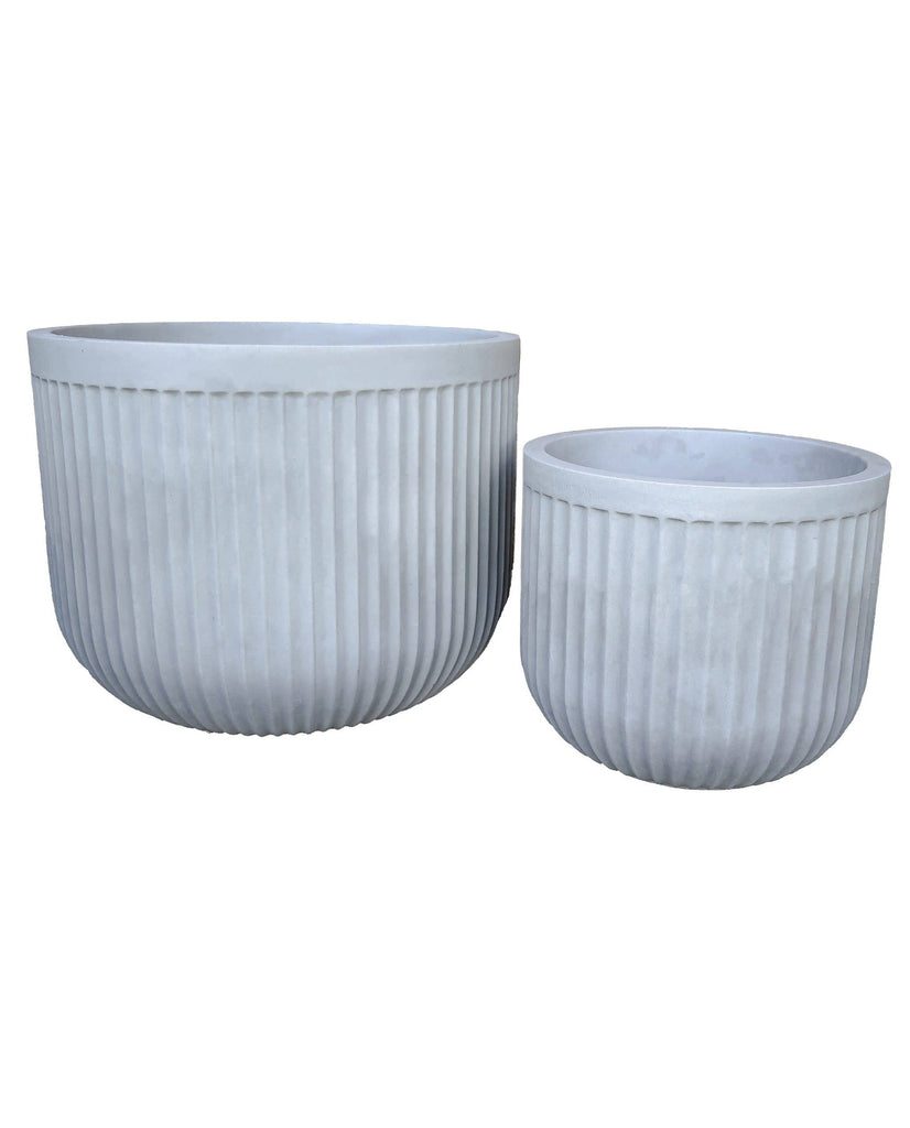 Medium and large round planters, On trend unique fluted design. Wide base, Low rise. Great for indoors and outdoors. Colour burnt cement