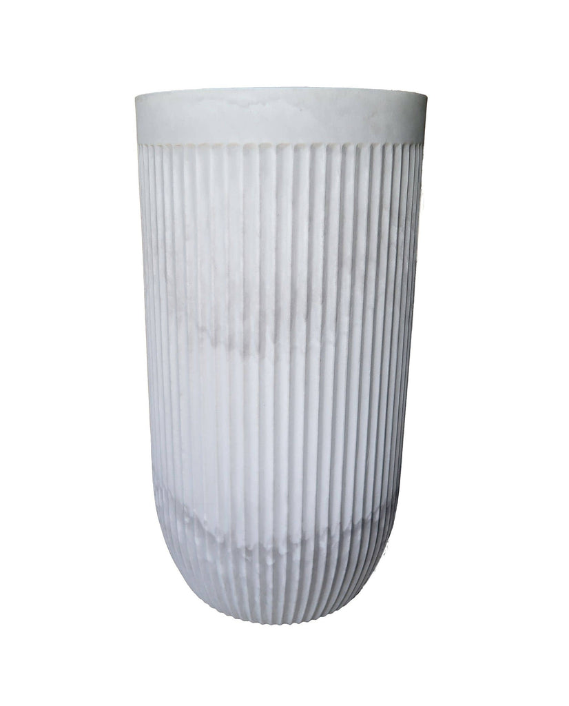 Side view of the tall and elegant planter showing off the unique fluted design in the colour burnt cement