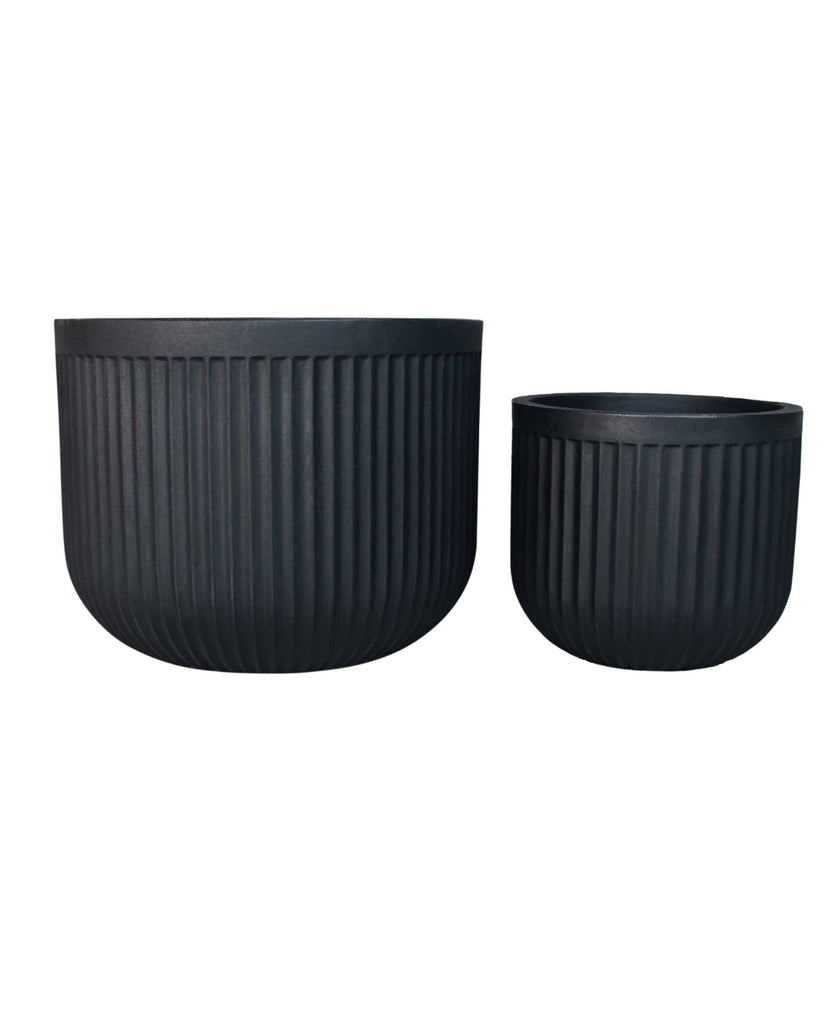 Medium and large round planters, On trend unique fluted design. Wide base, Low rise. Great for indoors and outdoors. Colour lead (black)